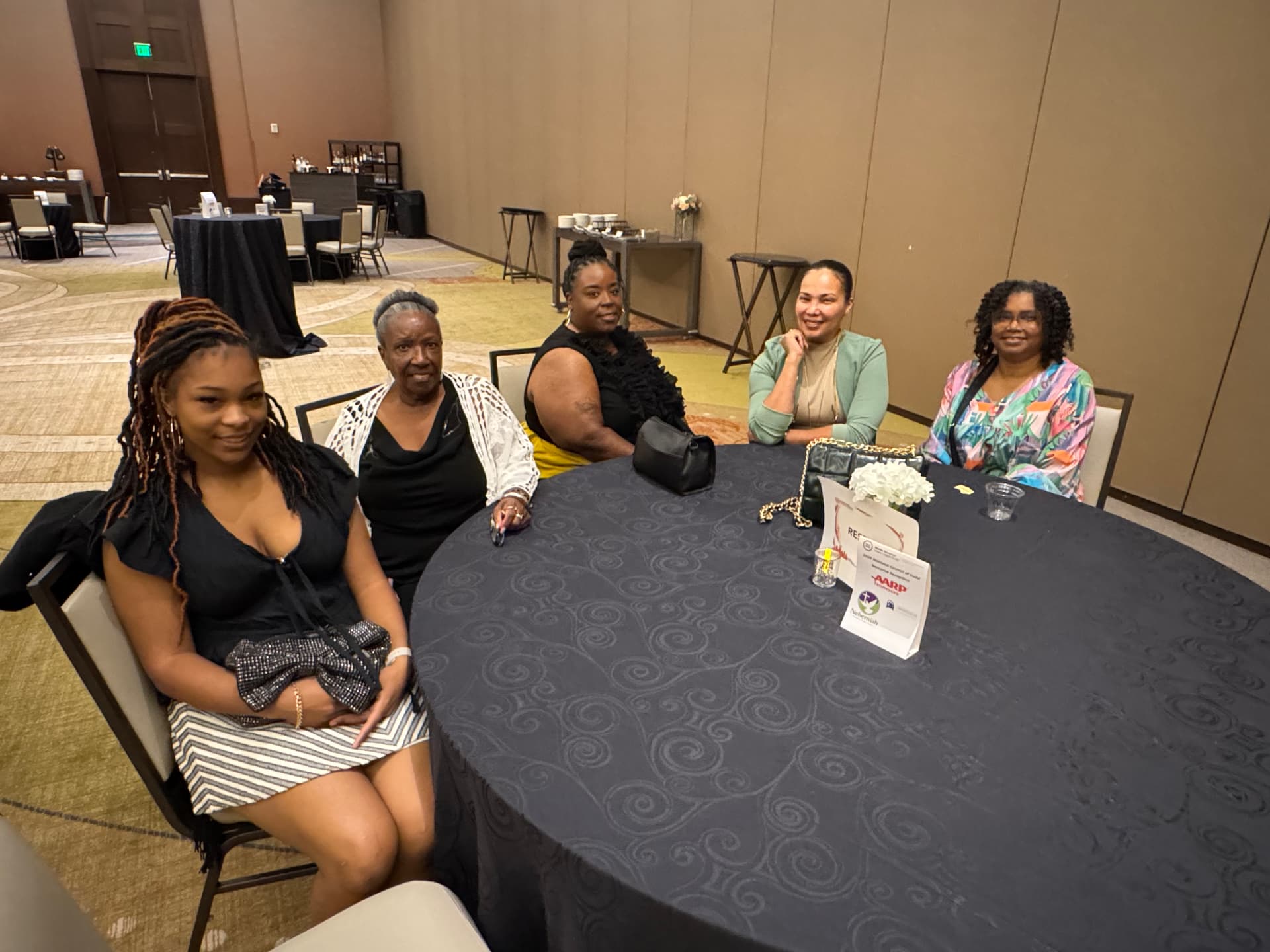 Women sharing fellowship at a reception table